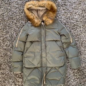 The popular Orolay down puffer coat. New with tags on Xs green